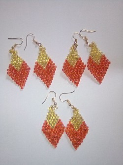 Red and gold beaded diamond earrings.